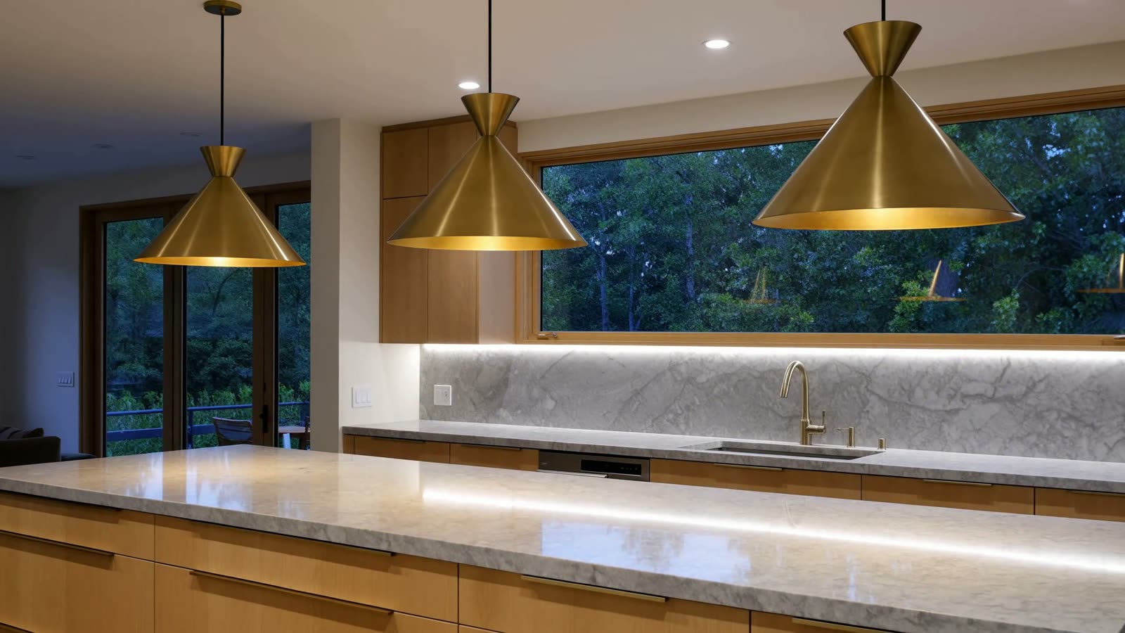 Animated illustration of a kitchen at summer dusk, three brass island pendants warming on. AI generated illustration, not a photograph of our work.